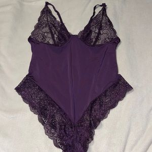 Dark purple lingerie bodysuit.
